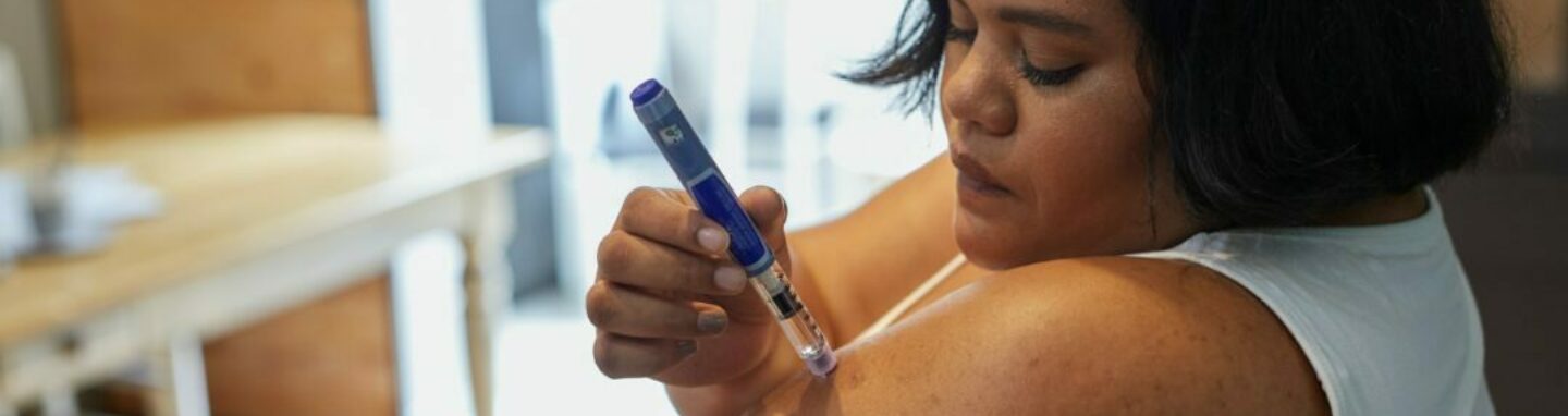 Woman using weight loss injection