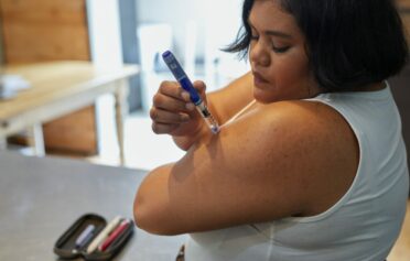 Woman using weight loss injection