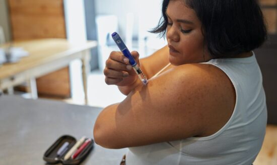 Woman using weight loss injection