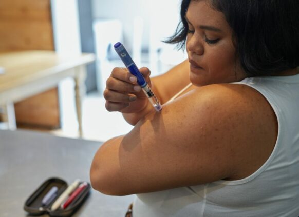 Woman using weight loss injection