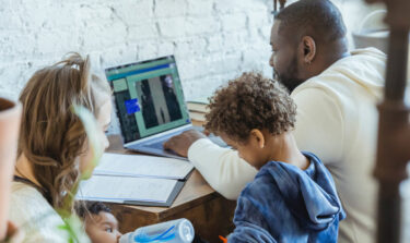 Family with man at desk