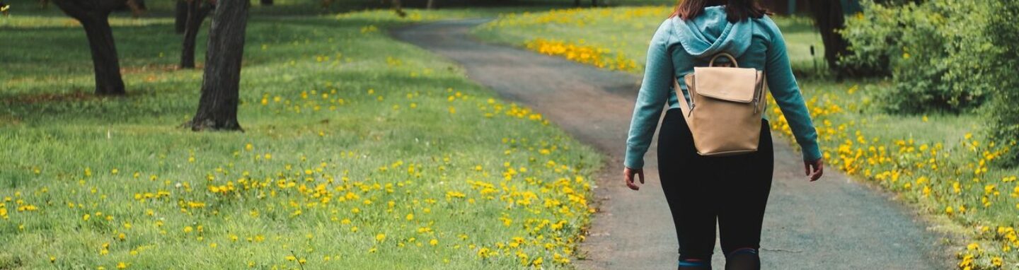 Person walking through park