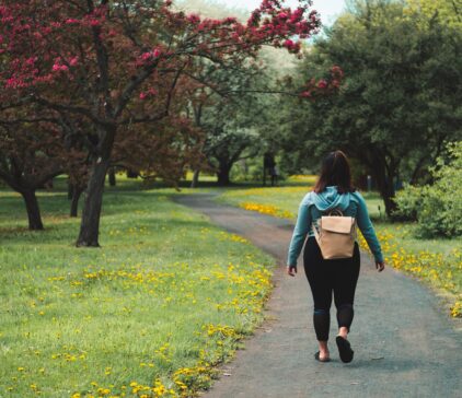 Person walking through park