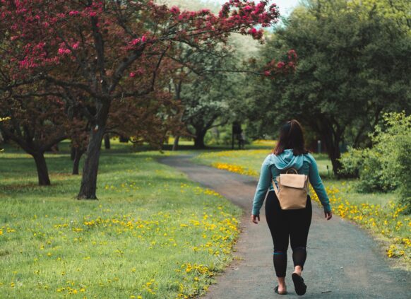 Person walking through park