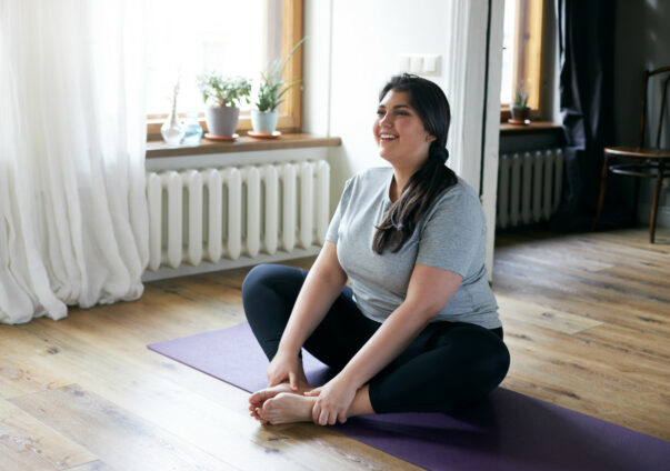 Woman stretching on exercise mat