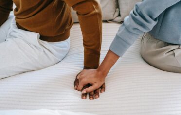 Two people holding hands