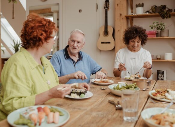 People eating a meal together round a table