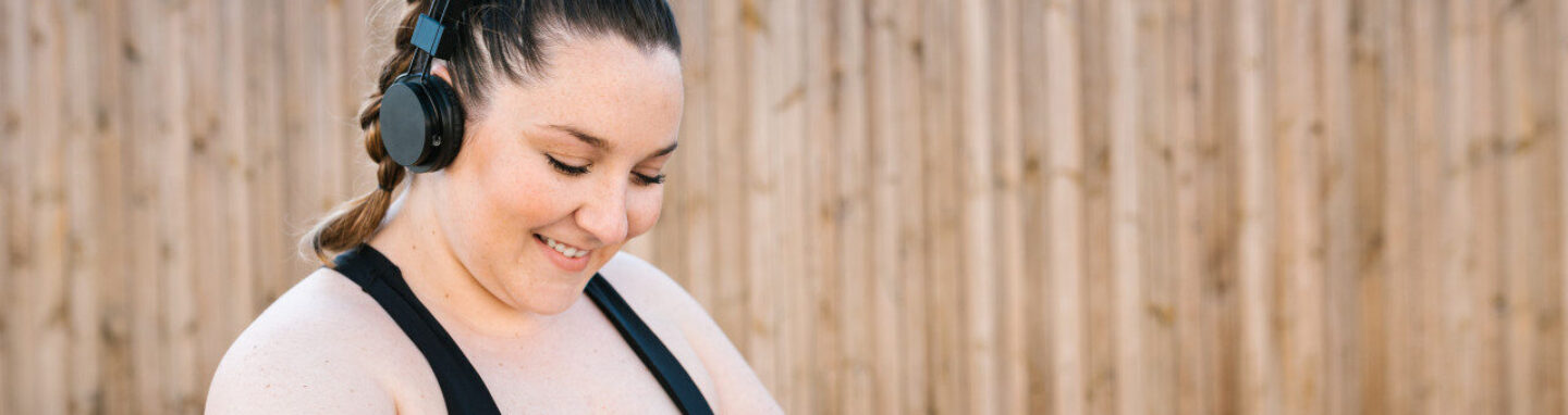 Woman in exercise wear checking her smartwatch