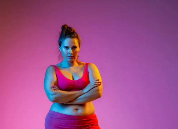 Woman with overweight in active wear