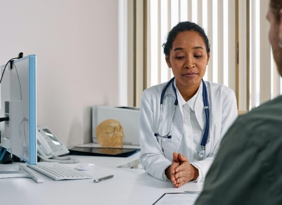 Doctor with patient in office