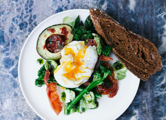 Healthy fats of avocado and egg on a plate