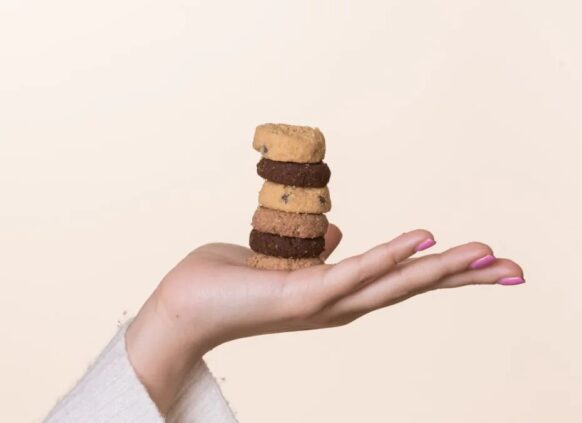 Hand holding a stack of cookies