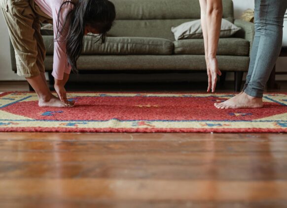 People training on a rug.