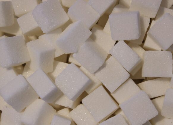 Close-up of white sugar cubes stacked together.