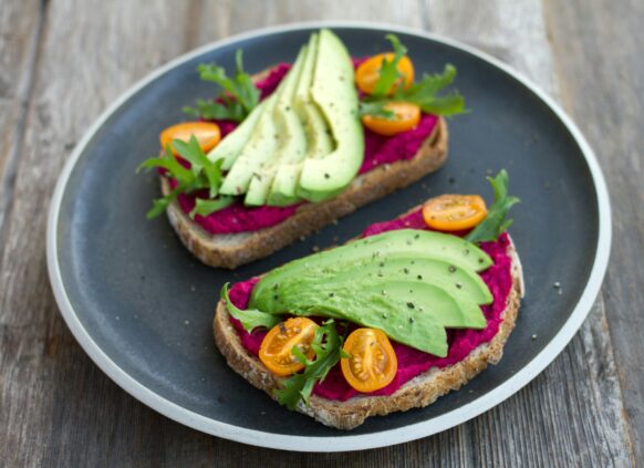 Toast with beetroot hummus and avocado