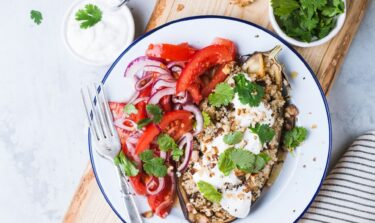 stuffed aubergine with tomato salad on the side