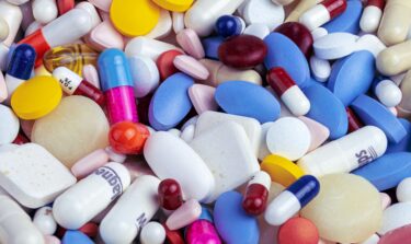 Colorful assortment of weight loss pills, capsules, and tablets.