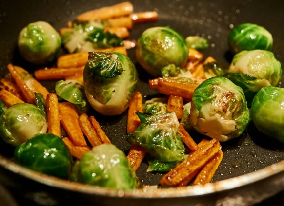 Roasted Brussels sprouts and carrots in a pan