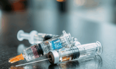 Three medical injections on a table