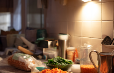 Ingredients on a countertop to make spinach and lentil soup