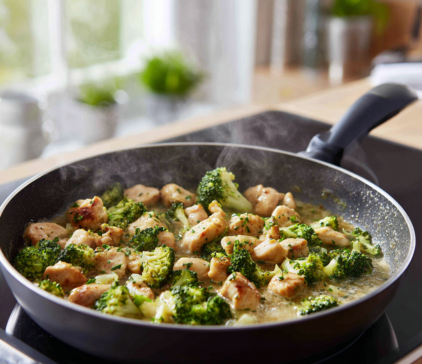 Wholewheat chicken penne cooking in a frying pan