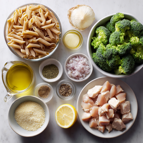 Ingredients for wholewheat chicken penne laid out on a kitchen bench