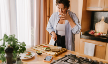 Woman making toast in the kitchen