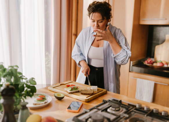 Woman making toast in the kitchen